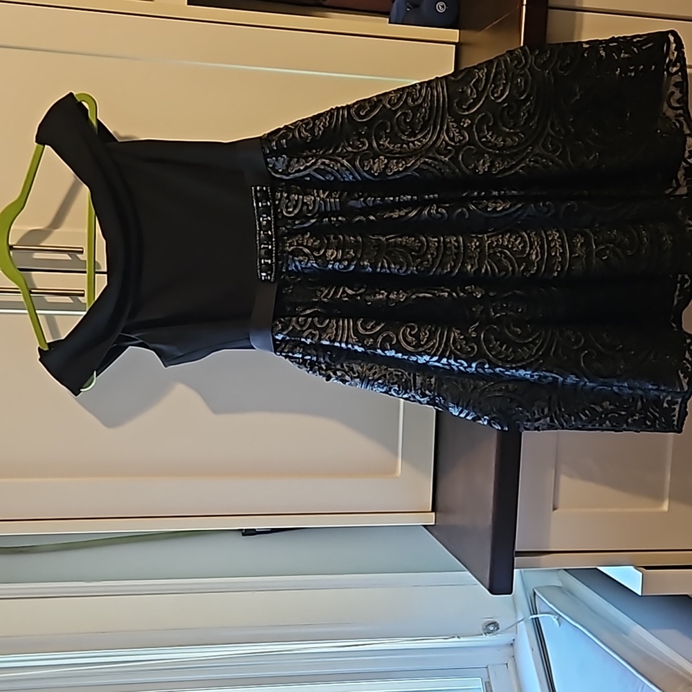 Teri Jon by RIckie Freeman black cocktail dress. Off the shoulder, calf length